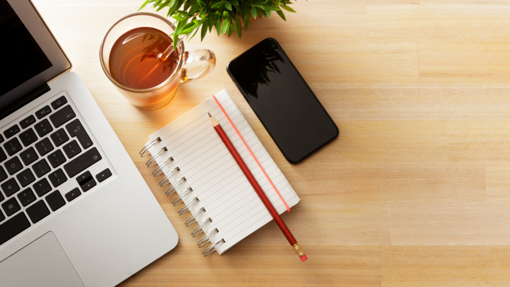 Birdeye view of a laptop and drink